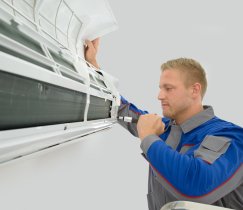 Mechanic repairing AC indoor unit