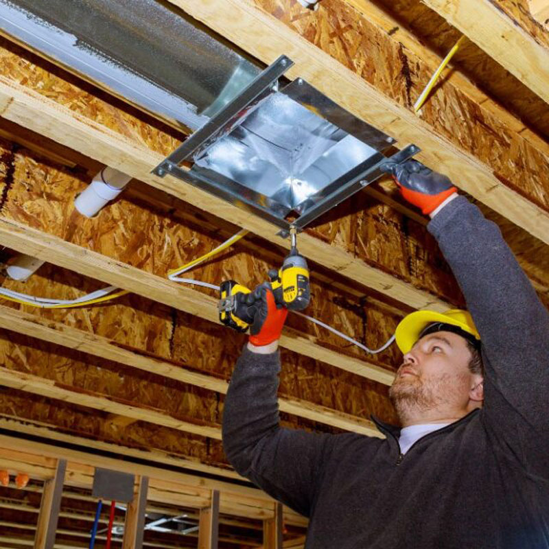 man repairing duct work