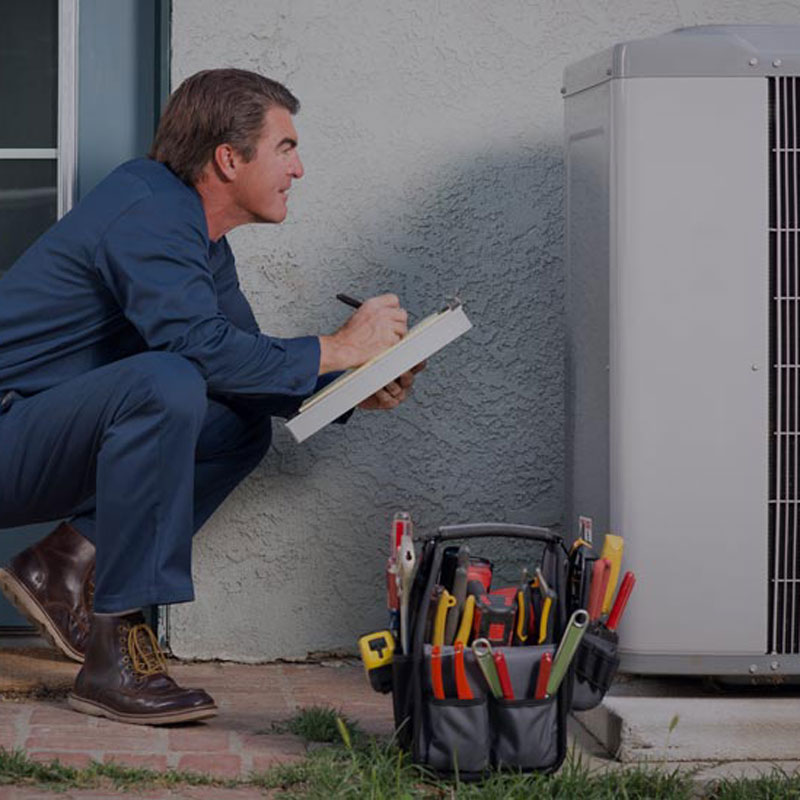 HVAC repair man and ac unit